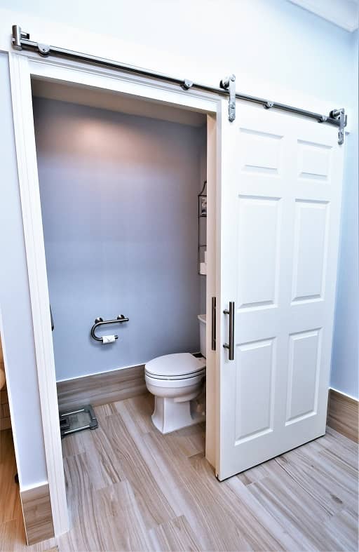 Memorial bathroom remodel - barn doors to toilet room